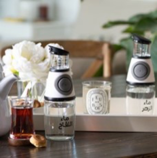 صورة زجاجة موزع صغيرة - بيضاء